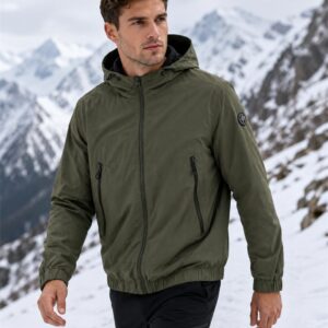 Reversible outdoor jacket in alpine snow scene